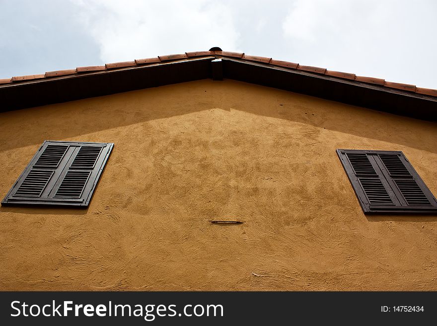 Orange roof of the yellow house