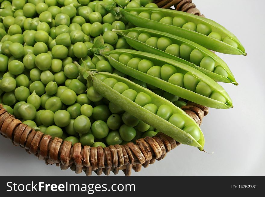 Basket of peas in spring