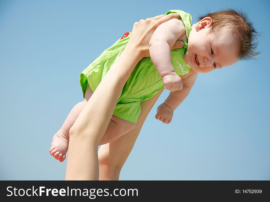 Flying baby on sky background