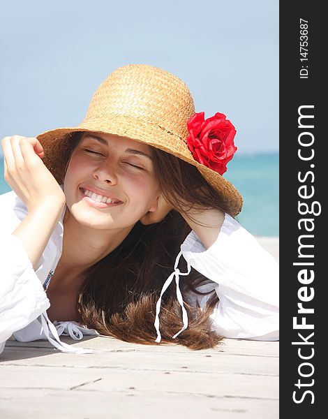 Young happy girl on sea background