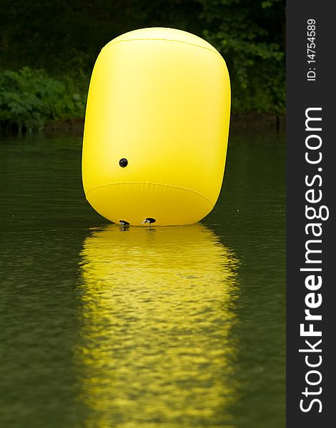 Yellow buoy in the water