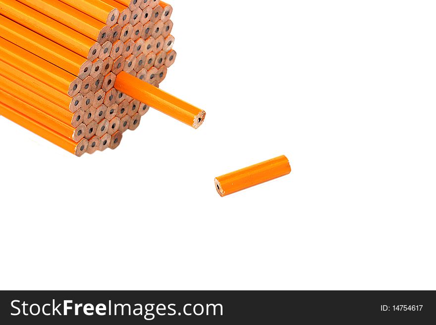 Pencil slice near to a pack on a white background. Pencil slice near to a pack on a white background.