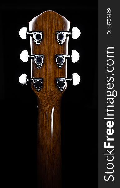 Guitar finger-board on a dark background. Guitar finger-board on a dark background