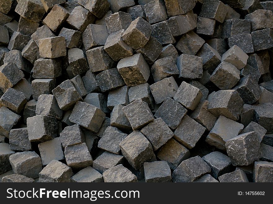 Cobblestone lie in a heap, ready to piling. Cobblestone lie in a heap, ready to piling