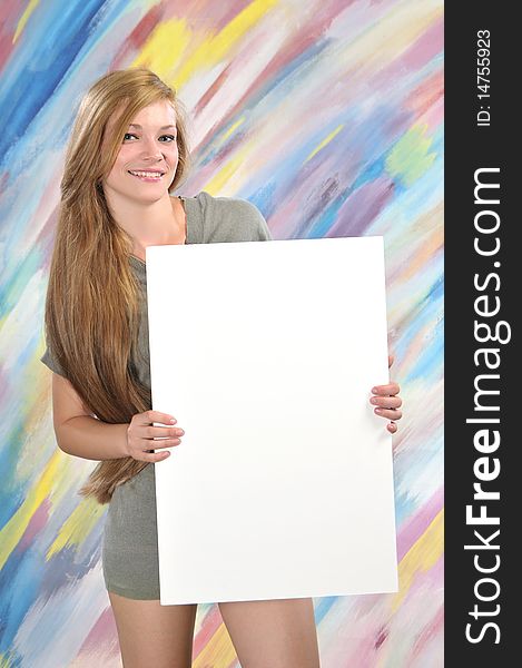 Beautiful blond woman, holding a blank paper for sign advertising. Beautiful blond woman, holding a blank paper for sign advertising