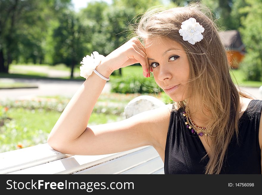 Girl Sitting On Bench