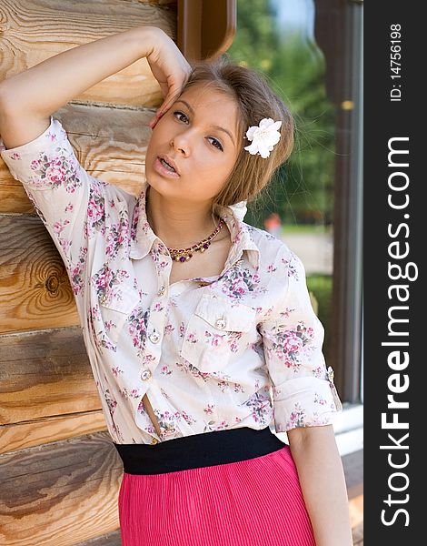 Girl standing on a veranda of a country house