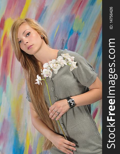Portrait of beautiful girl with white orchid