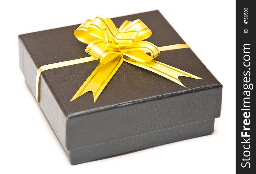 Black gift box with golden ribbon isolate on white