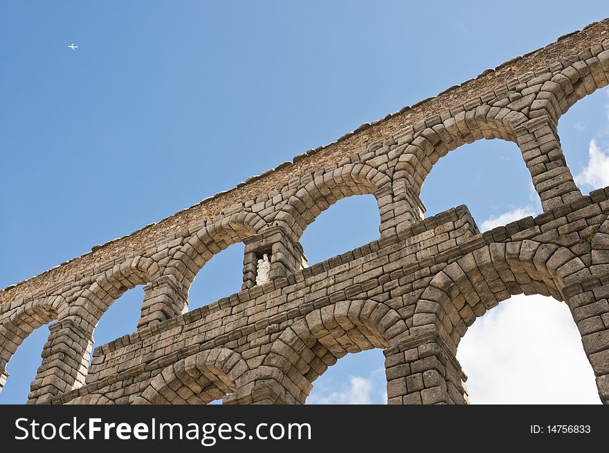 Aqueduct segovia with plane