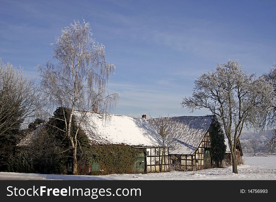 Farm in winter in Hilter-Hankenberge, Osnabruecker land, Lower Saxony, Germany. Farm in winter in Hilter-Hankenberge, Osnabruecker land, Lower Saxony, Germany