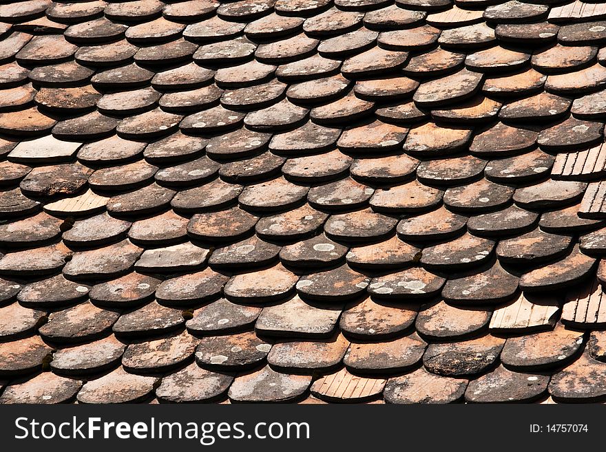 Close up of a old roof ceramic tiles. Close up of a old roof ceramic tiles