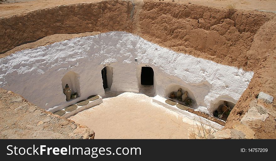 Underground house in a village on the edge of Sahara desert in Tunisia. Underground house in a village on the edge of Sahara desert in Tunisia