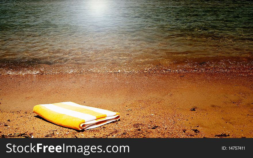 Turquoise sea and towel.