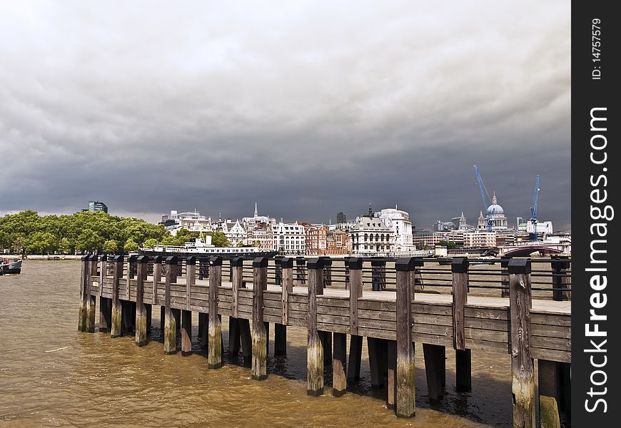 London city view river thames with pier in stormy weather. London city view river thames with pier in stormy weather