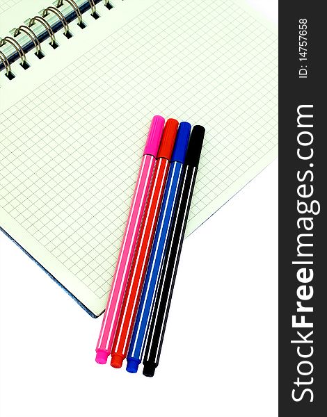 Squared Notebook and Colorful Pens. Squared Notebook and Colorful Pens