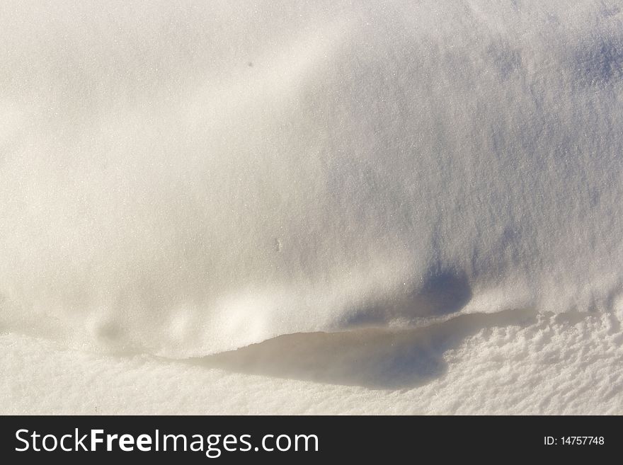 A snow drift with shadows