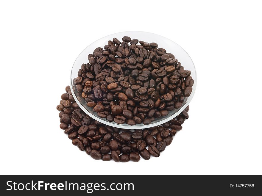 Coffee beans on a plate, white background isolated
