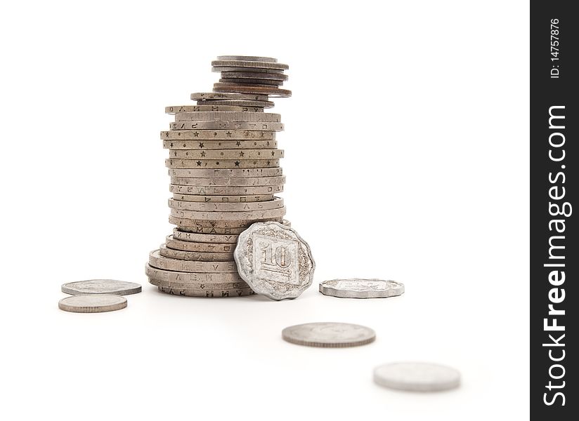 Various steel coins combined by a column on a white background