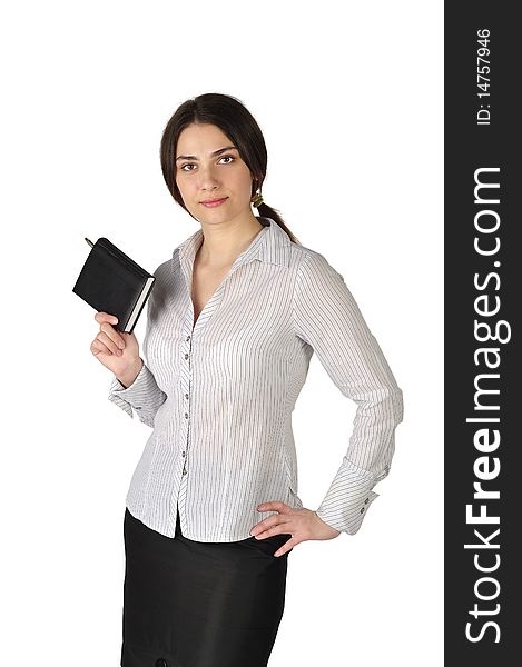 The beautiful business woman in a suit holds a notebook on a white background. The beautiful business woman in a suit holds a notebook on a white background