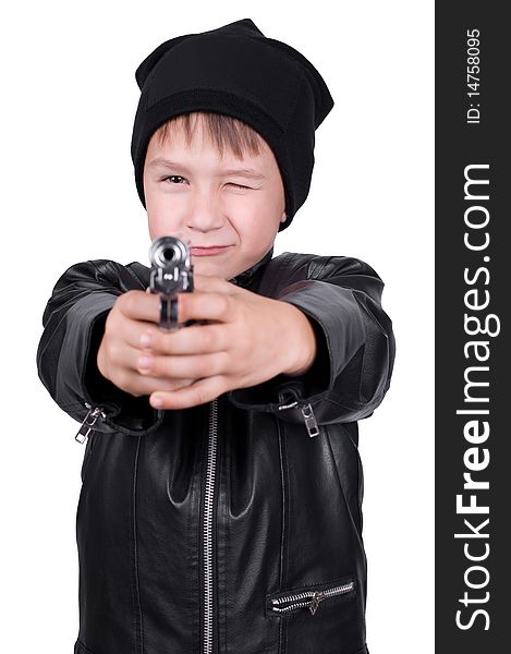 Young boy pointing gun, focus on boys face, isolated