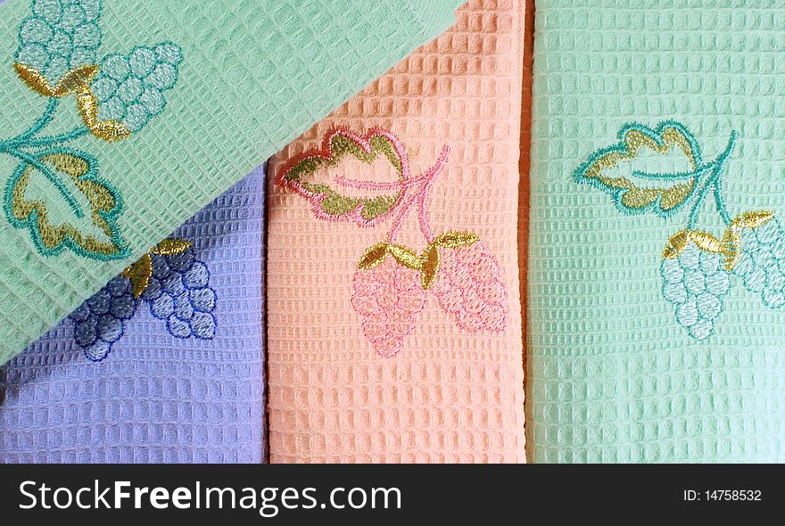 Towels of various colours with the embroidered bunches