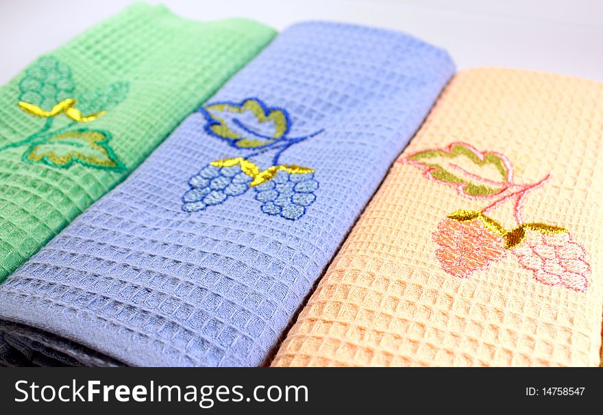 Towels of various colours with the embroidered bunches