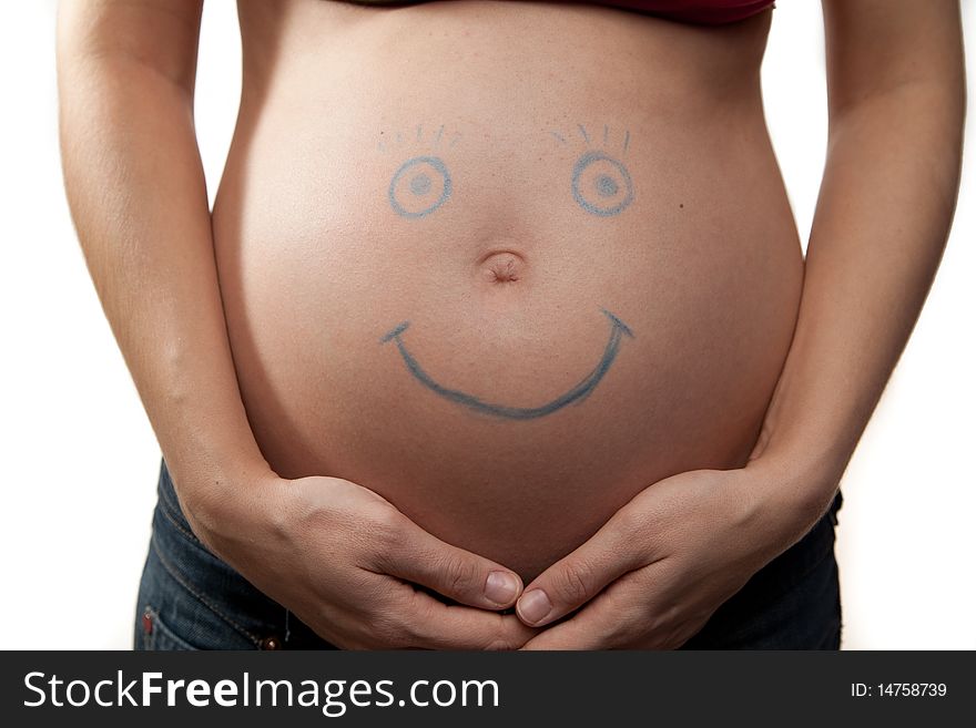 Pregnant belly with painted smile. Pregnant belly with painted smile