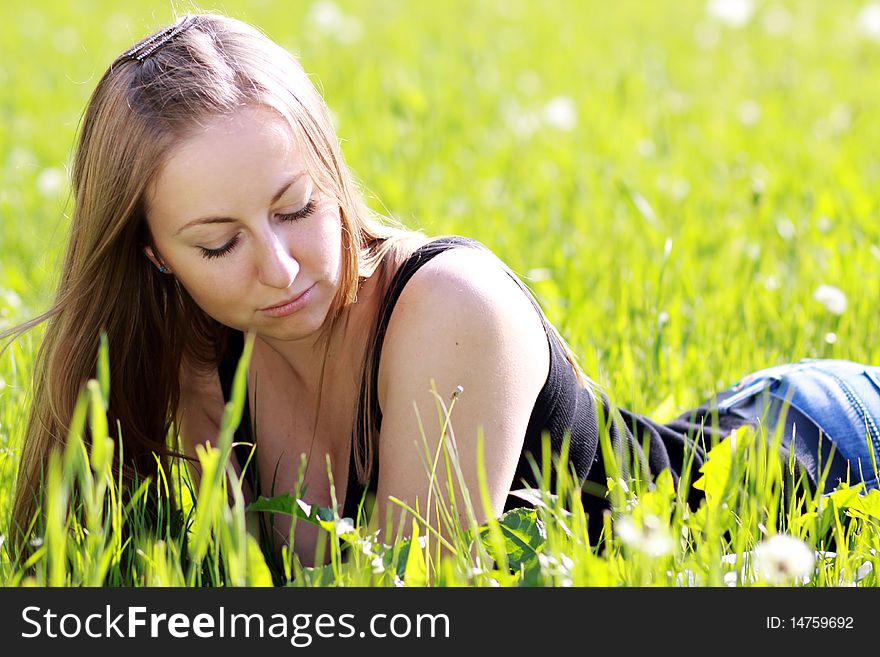 Happy woman on the green grass