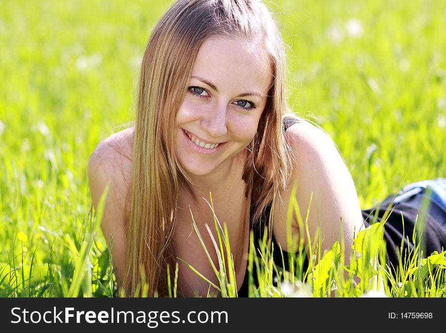 Happy woman on the green grass