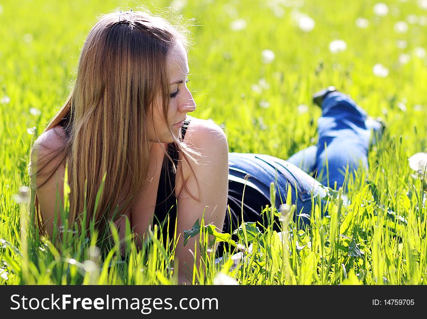 Happy woman on the green grass