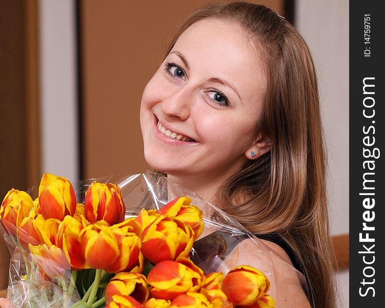 Portrait of beautiful girl with tulips