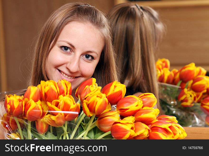 Portrait of beautiful girl with tulips