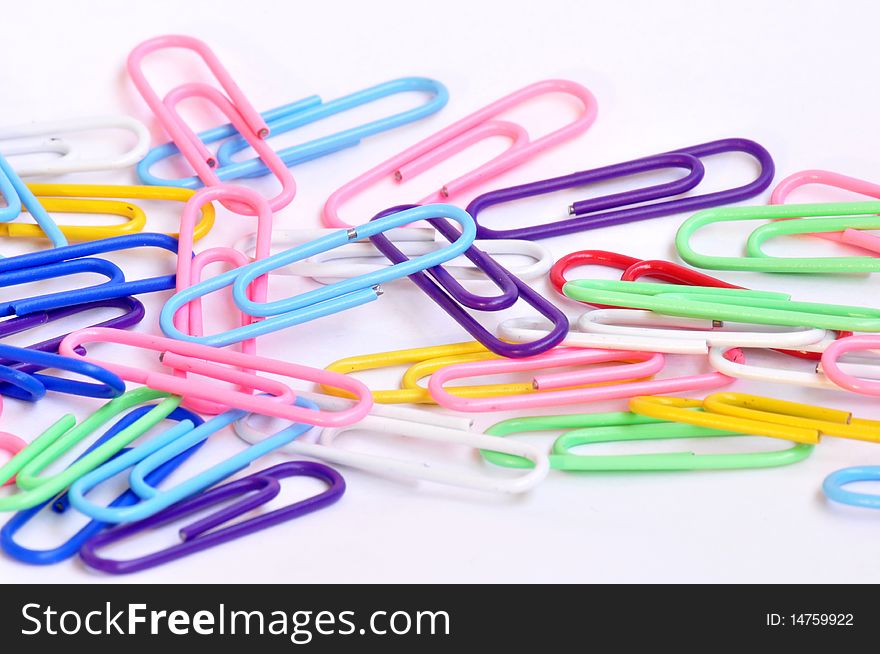 Colorful paper clips isolated on white background