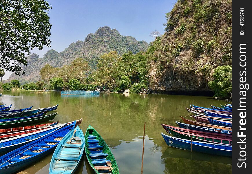 Colorful Boats in a green lake in Myanmar Burma