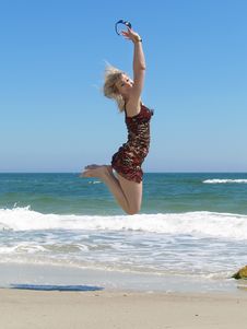 Young Blonde Woman Vacationing At The Beach Royalty Free Stock Photo