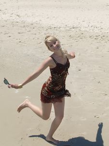 Young Blonde Woman Vacationing At The Beach Royalty Free Stock Photos