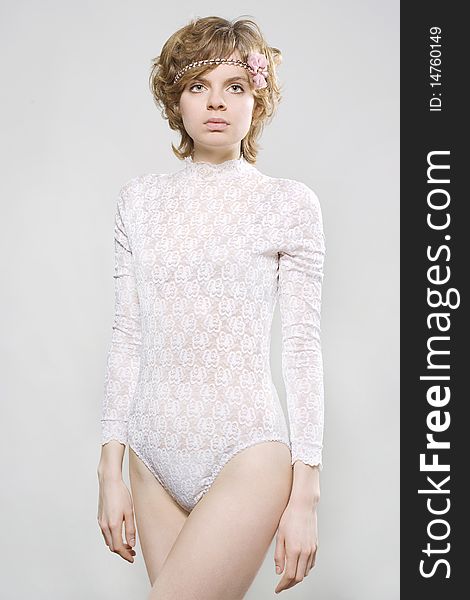 Fashion portrait of a young woman dressed in lace underwear. Fashion portrait of a young woman dressed in lace underwear.