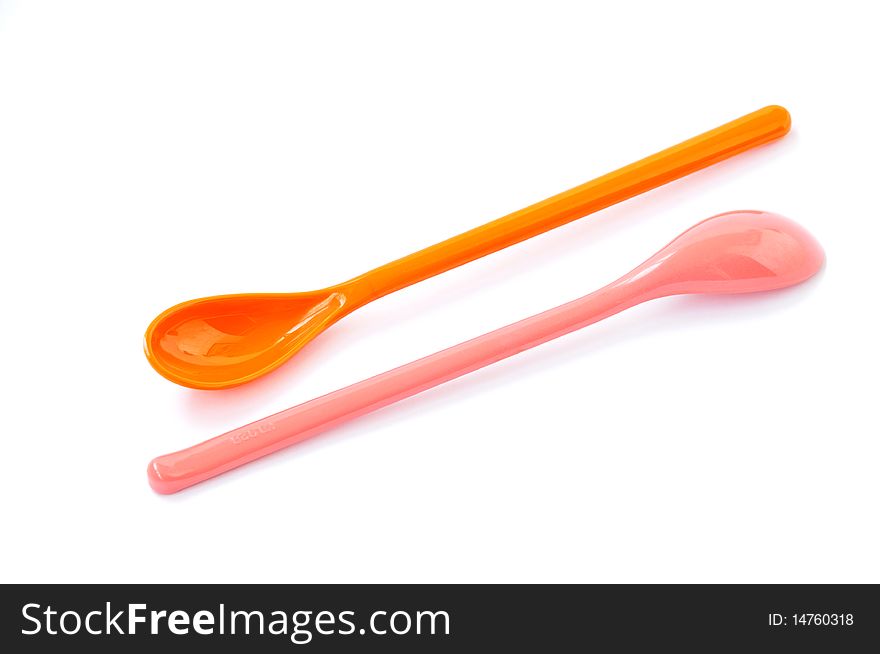 A pair of colorful spoons isolated on a white background