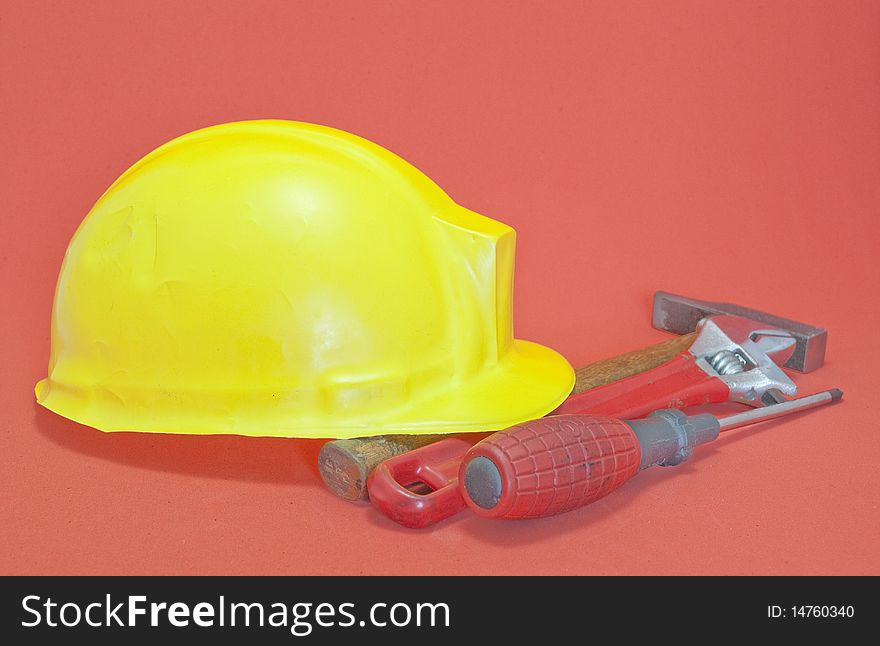 Helmet are yellow with red background tools. Helmet are yellow with red background tools