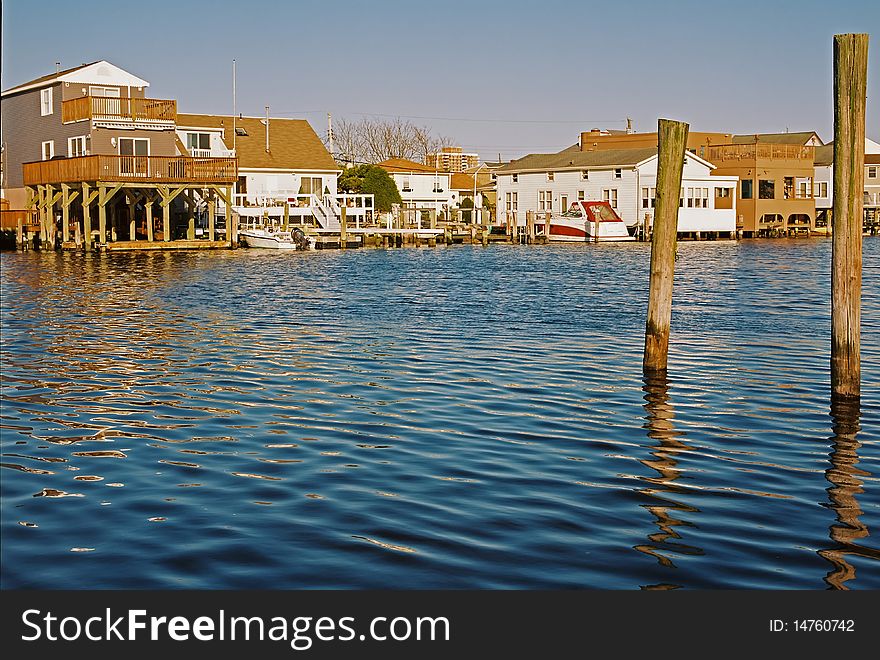 An intercoastal waterway with homes in the background. An intercoastal waterway with homes in the background