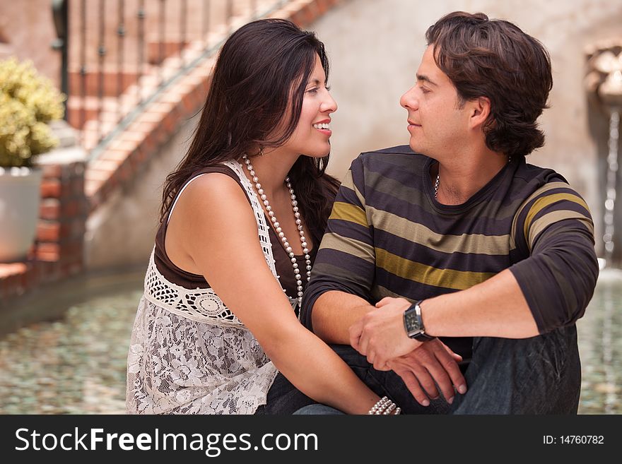 Attractive Hispanic Couple Portrait Enjoying Each Other Outdoors. Attractive Hispanic Couple Portrait Enjoying Each Other Outdoors.