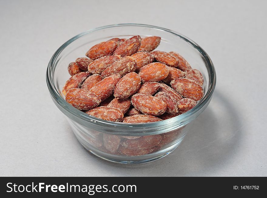 Isolated Bowl of Smoked Almonds on Background