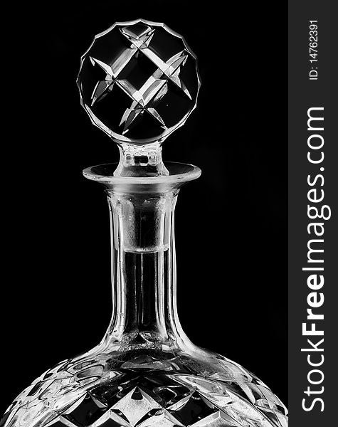 A glass alcohol container / decanter against a white background