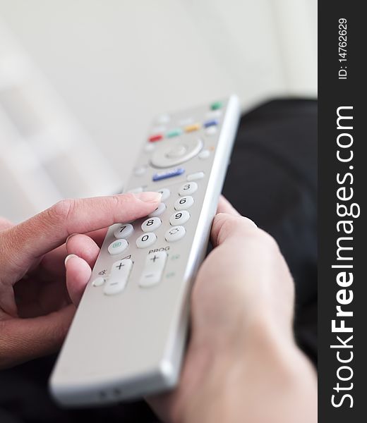 Close up of hand holding a Remote Control