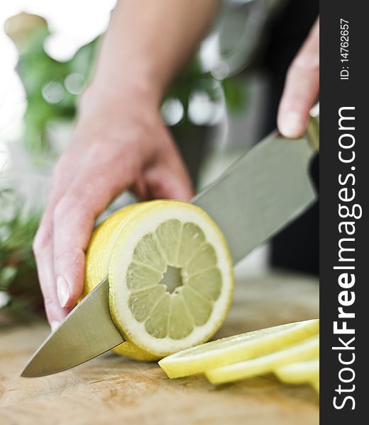 Close up of Human Cutting Lemon