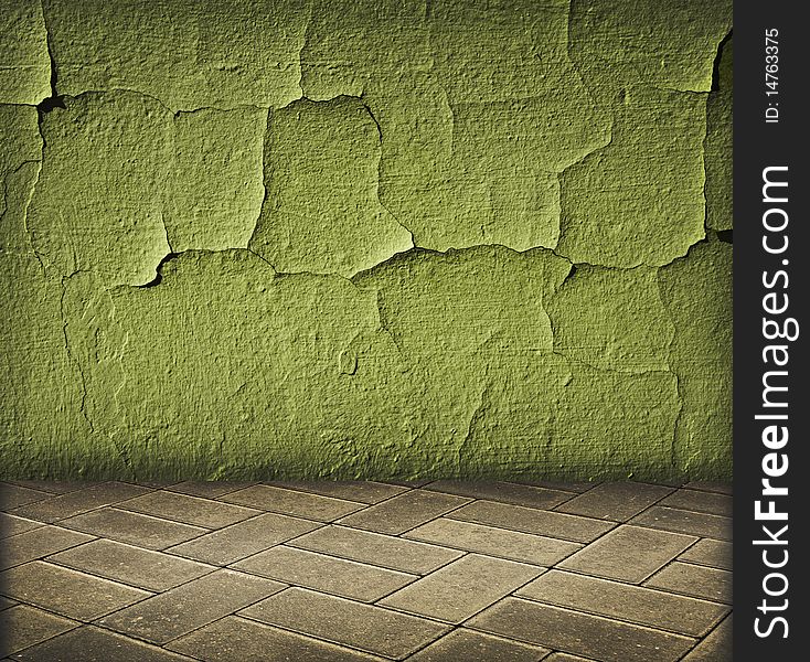 Vintage interior with green cracked wall