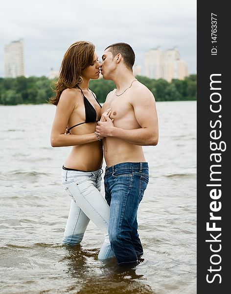 Couple on a river bank