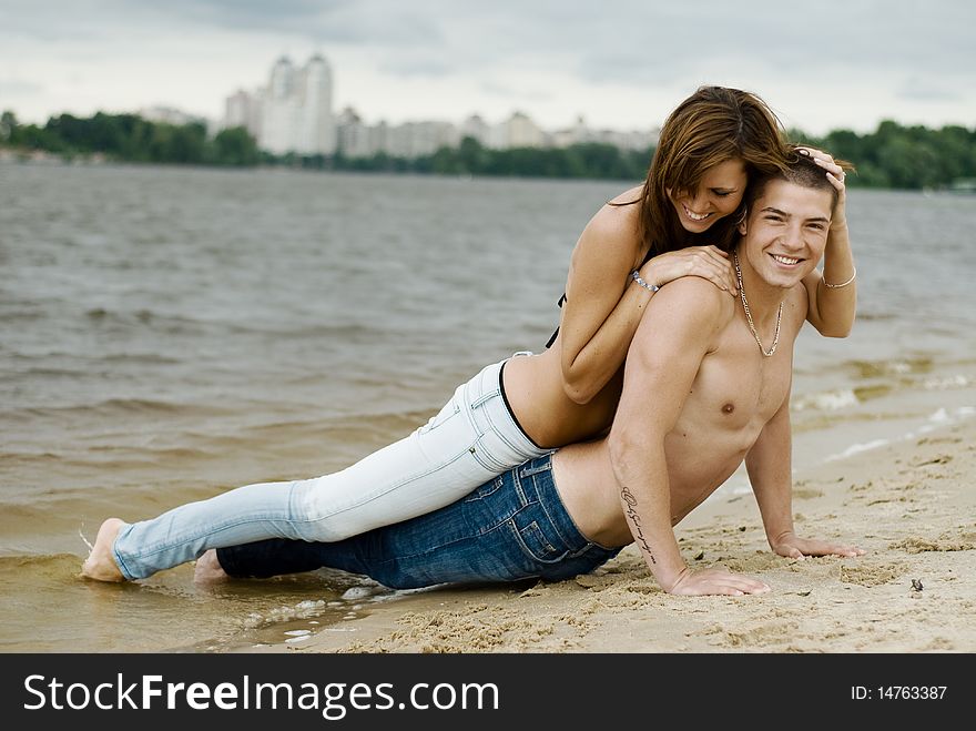 Couple On A River Bank