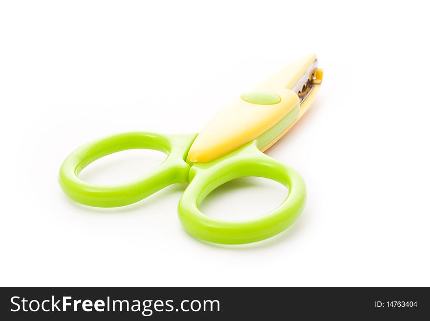 Green and yellow scissors isolated on white